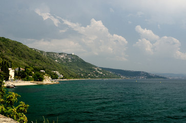 Obraz premium beach below the lighthouse of Trieste, Friuli Venezia-Giulia, Italy