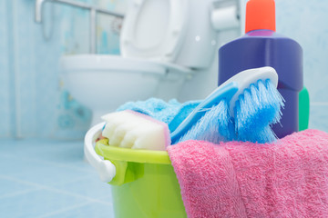 Cleaning with a bucket and cleaning products on blurred background. - Image