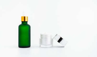Serum bottle cream, mockup of beauty product brand. Top view on the white background.