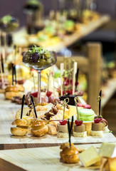 Mini canape with cheese meat and seafood close-up shot.