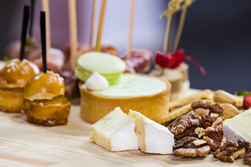 Mini canape with cheese meat and seafood close-up shot.