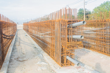 The workers are preparing a steel construction to build a new bridge