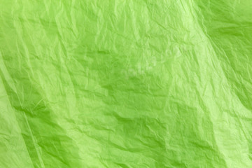 Abstract texture of green cellophane garbage bag. macro close-up background