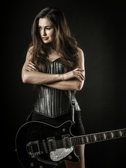 Sexy woman with electric guitar