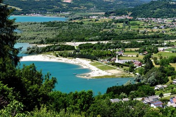 Fototapeta premium Aerial view of small italian village Farra D'Alpago in alps near Santa Croce lake.