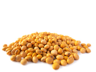Raw dried soybeans isolated on white background.