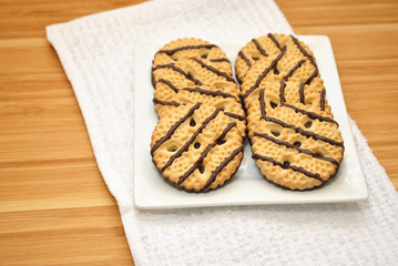 Vanilla and Chocolate Dessert Cookies on a White Plate