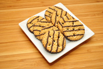 Vanilla and Chocolate Dessert Cookies on a White Plate 