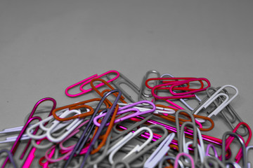 Multi color paper clips with grey background