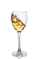 White wine in a wine glass with splashes isolated on white background.