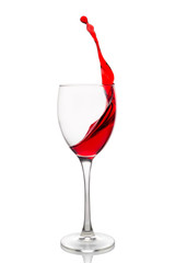 Red wine splash in a glass isolated on white background. 