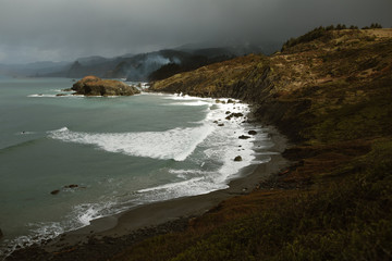 ocean cove in rain storm