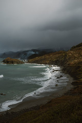 ocean cove in rain storm