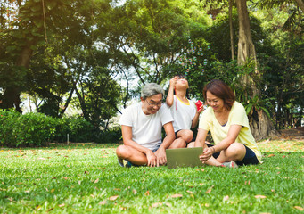 Girl in a field trips and playing blowing bubbles with family in the green park, Outside school education concept