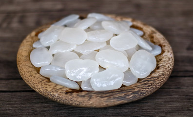 Sugar palm fruit on wooden plate on wood background.