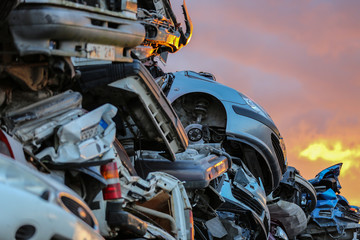 Details of used cars in a junkyard at sunset, Gotland Sweden.