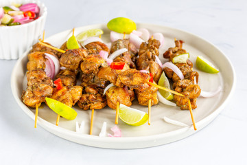 Chicken Satay with Peanut Sauce and Salad Popular Indonesian and Thai Appetizer. Thai Food, .Oriental Cuisine, Barbecue Chicken.