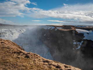 The famous Iceland Waterfall Gullfoss with huge water steam in the air
