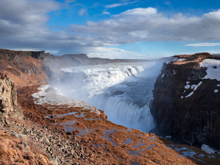 The famous Iceland Waterfall Gullfoss with huge water steam in the air