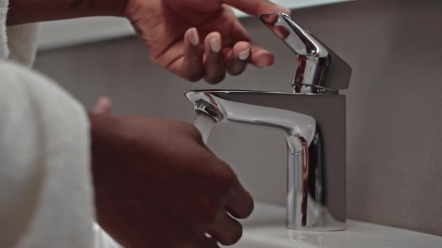 Black Person Washing Hands