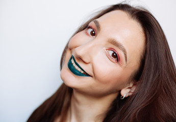 Close up selfie portrait of pretty young woman with creative make up