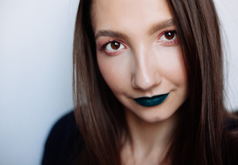 Close up selfie portrait of pretty young woman with creative make up