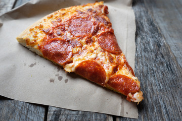Hot slice of pepperoni pizza