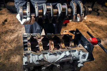 Automotive four-cylinder engine water cooling during repair.