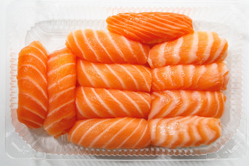 sashimi sushi set in a plastic box container