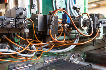 Hydraulic system of the machine, oil under pressure in hydraulic pipes, repair of industrial...
