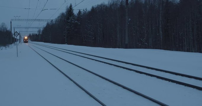 Passenger train in winter evening