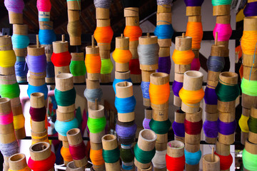 Colorful spools of thread in paper umbrella factory Chiang Mai