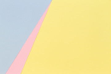 Abstract geometric shape pastel yellow, pink and blue color paper background