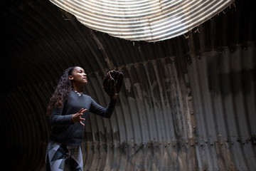 Girl preparing to catch ball thrown at her