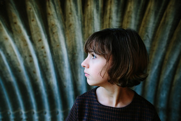 Girl standing in tunnel