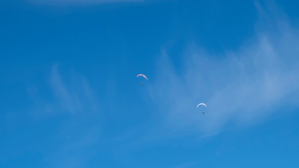 Obraz na płótnie Canvas parachutist in the blue sky above ski resort Pitztal Hoch Zeiger, Austria.