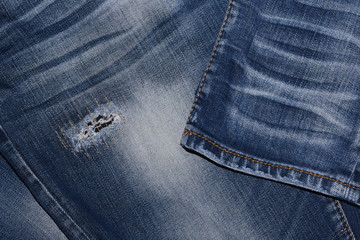 Fototapeta premium The surface of the jeans with torn marks, Texture Blue jean.