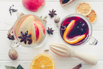 Two glasses of different type of mulled wine