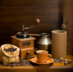 cup of coffee, turka, coffee beans and a coffee grinder, croissants