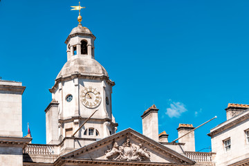 Fototapeta na wymiar London, UK Horse Guards Parade Whitehall building in the city of Westminster architecture closeup of clock tower blue sky
