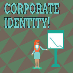 Text sign showing Corporate Identity. Business photo text firm or business presents themselves to the public Businesswoman Holding Stick Pointing to Chart of Arrow Upward on Whiteboard