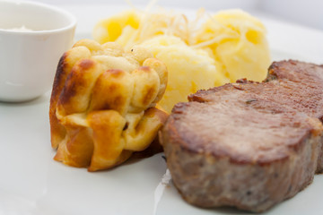 Yorkshire pudding and roast beef with mashed potatoes and gravy