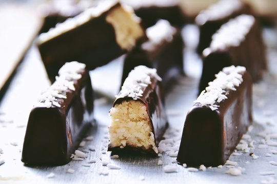 Homemade chocolate coconut bars. Sugar free, no bake. Keto, paleo, vegan bites