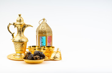 Premium dates, lantern and arabic coffee set on white background. Selective focus, copy space and Ramadan Kareem concept