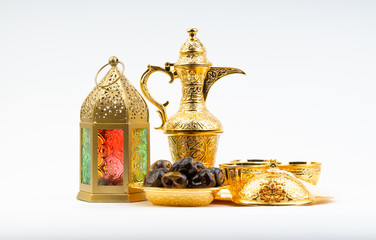 Premium dates, lantern and arabic coffee set on white background. Selective focus, copy space and Ramadan Kareem concept