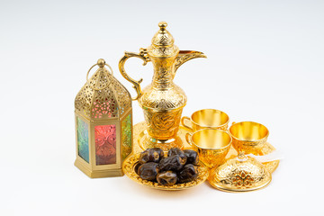 Premium dates, lantern and arabic coffee set on white background. Selective focus, copy space and Ramadan Kareem concept