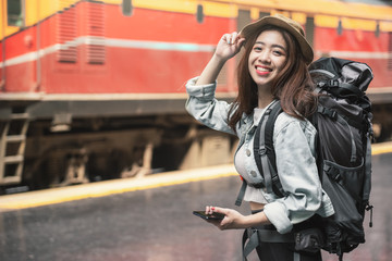 Woman Traveler with backpack traveling on her summer vacation. Summer Holiday Travel Destination...
