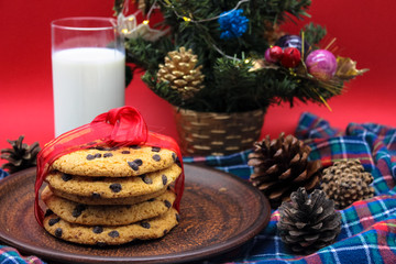 A glass of milk and cookies for Santa. Christmas Eve Concept.