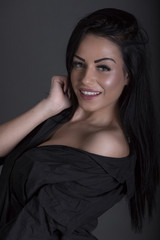 Fototapeta premium Closeup Studio Portrait Beauty Brunette Woman Wearing Black Clothes Grey