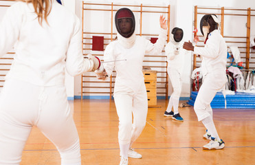 Fencers exercising techniques in battle